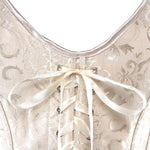 les lacets d'attaches d'un corset de couleur crème
