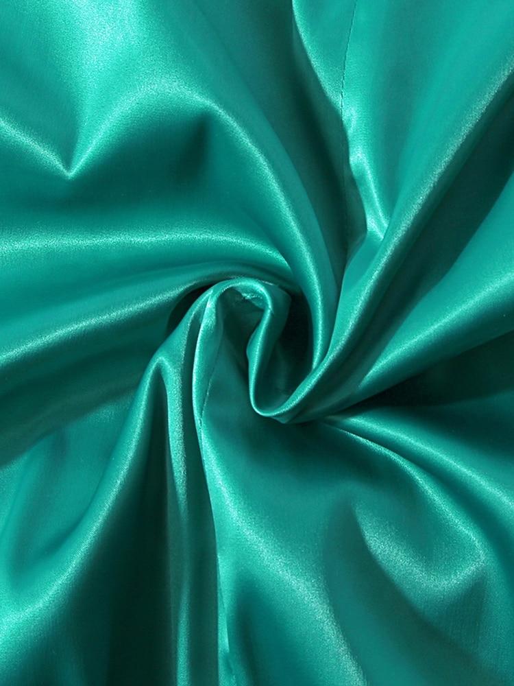 le tissu vert d'une robe corset pour femme